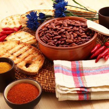 dry legumes in rustic dish on wooden table