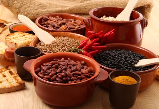 dry legumes in rustic dish on wooden table