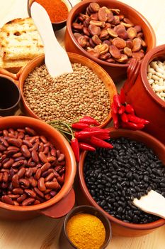 dry legumes in rustic dish on wooden table