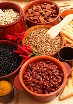 dry legumes in rustic dish on wooden table