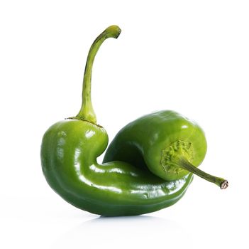 fresh hot peppers on white background