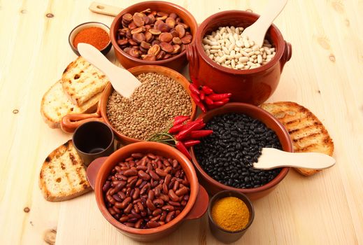 dry legumes in rustic dish on wooden table