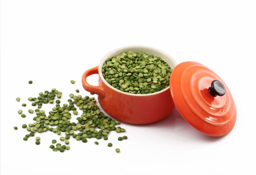 dry peas in pot on white background