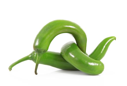 fresh hot peppers on white background