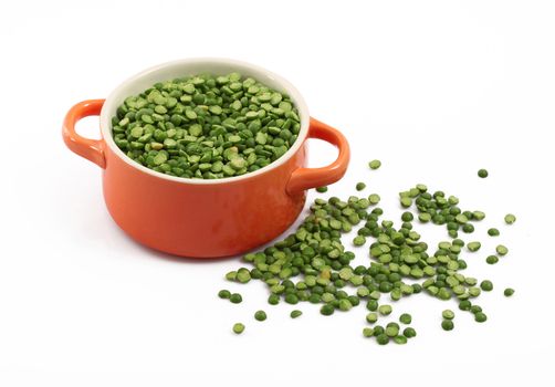 dry peas in pot on white background