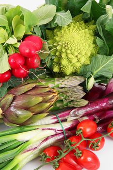 a fresh group of vegetables on white background