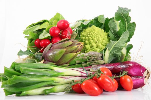 a fresh group of vegetables on white background