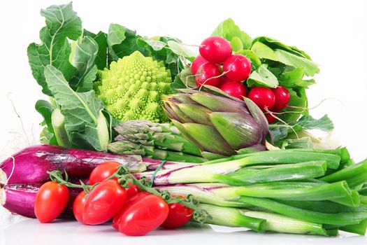 a fresh group of vegetables on white background