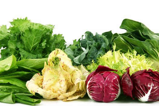a fresh group of vegetables on white background