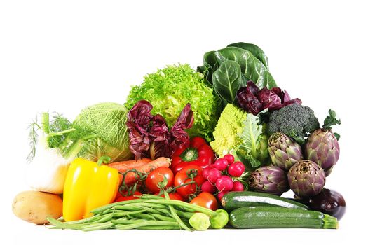 a fresh group of vegetables on white background