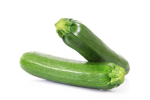 a fresh zucchini on white background