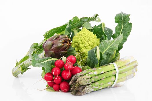 a fresh group of vegetables on white background