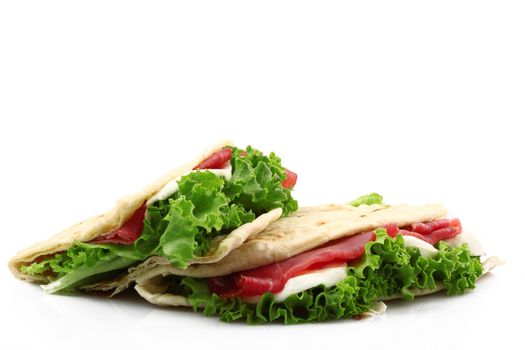 italian flat bread with salade and ham collage
