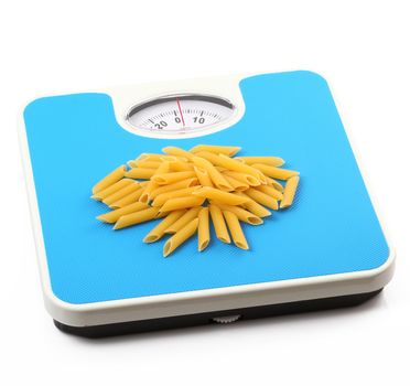 bathroom scale with italian raw pasta