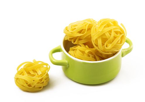 italian raw pasta in green pot