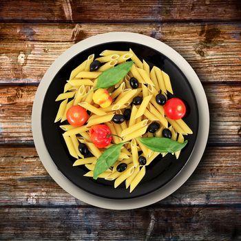 black dish with raw italian pasta and ingredients