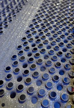 Details of perforated industrial steel background