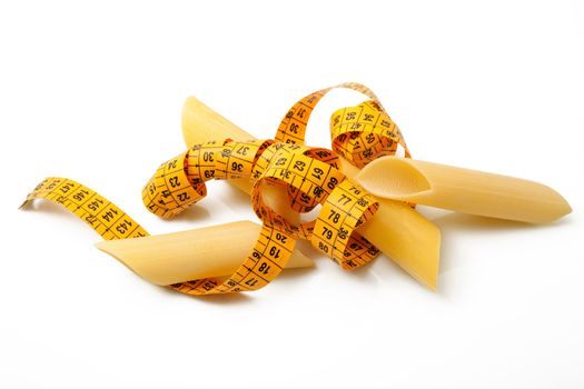 italian raw pasta on white background with metre