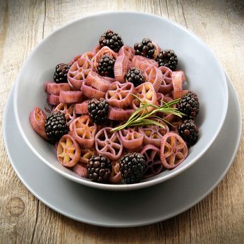 delicious italian pasta with blackberries