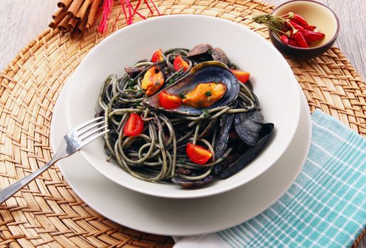 italian spaghetti with squid ink and mussels