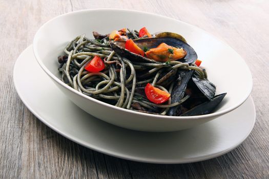 italian spaghetti with squid ink and mussels