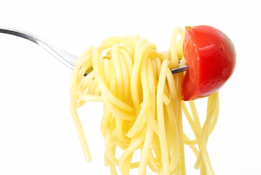 italian spaghetti on fork with tomato