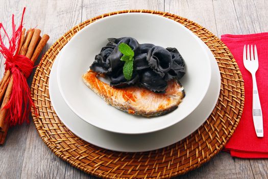 original italian ravioli with squid ink and salmon