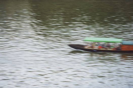 motor boat floats on the river in summer time