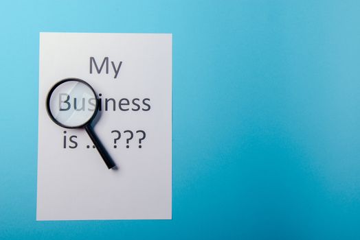 My business is word concept. Business word with business document paper on blue background. For business concept ideas background.