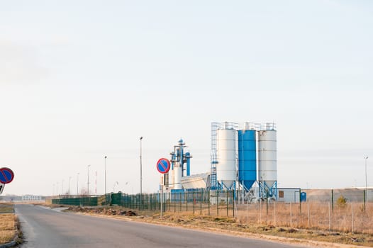Modern industrial exterior building over blue sky