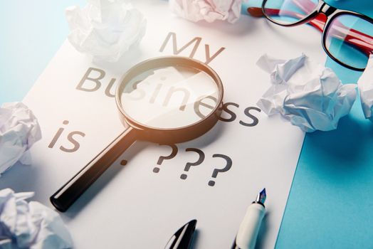 My business is word concept. Business word with business document paper on blue background. For business concept ideas background.