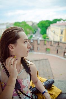 Beautiful girl during sightseeing old castle in Cracow, Wawel. Summer time
