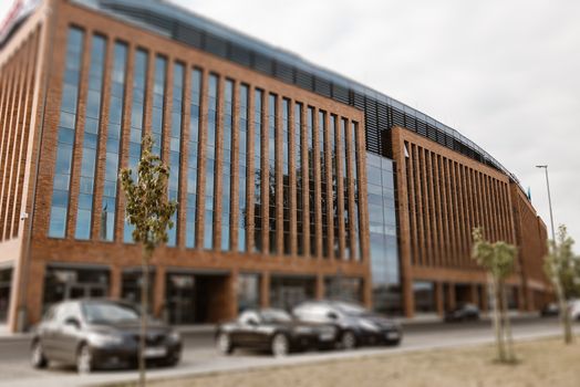 Office building with motion blurred clouds, business concept. Office building in Szczecin, Poland.