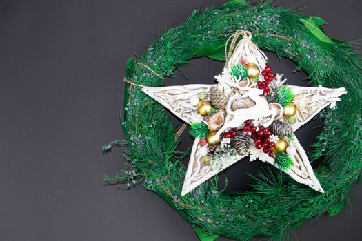 Christmas wreath with handmade star and deer, with left free part for text