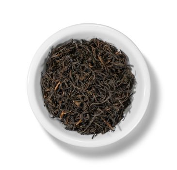 Black tea top view on white background.