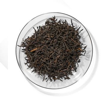 Black tea top view on white background.