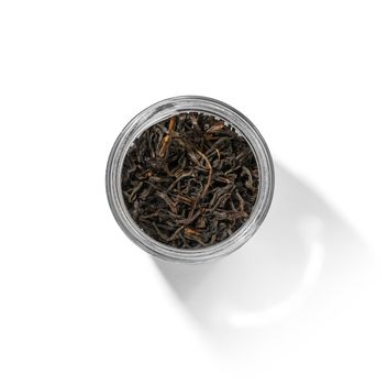 Black tea top view on white background.