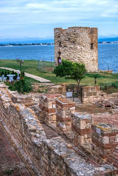 Nessebar, Bulgaria – 07.10.2019. Old Windmill on the promenade of Nessebar, Bulgaria, on a cloudy summer evening