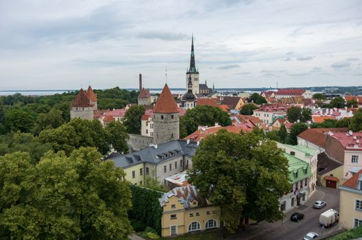 Tallinn, Estonia - July 29, 2017:  Aerial cityscape with Medieval Old Town, St. Olaf Baptist Church and Tallinn City Wall, Tallinn, Estonia