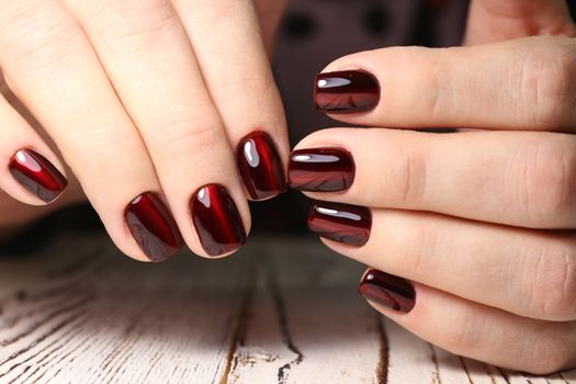 glamorous beautiful manicure on a trendy texture