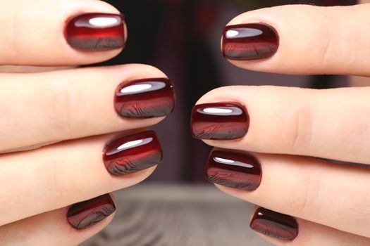 glamorous beautiful manicure on a trendy texture