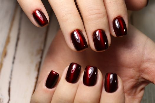 glamorous beautiful manicure on a trendy texture