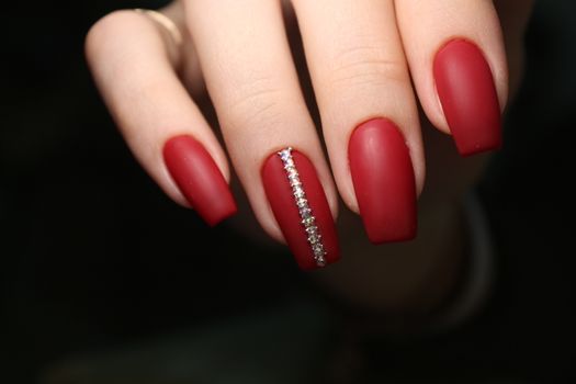 glamorous beautiful manicure on a trendy texture