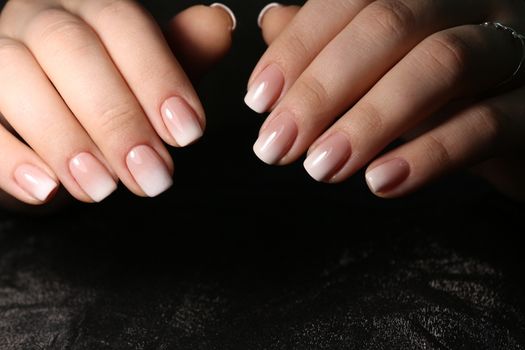 glamorous beautiful manicure on a trendy texture