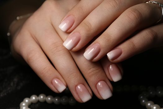 sexy gray manicure on a trendy texture background