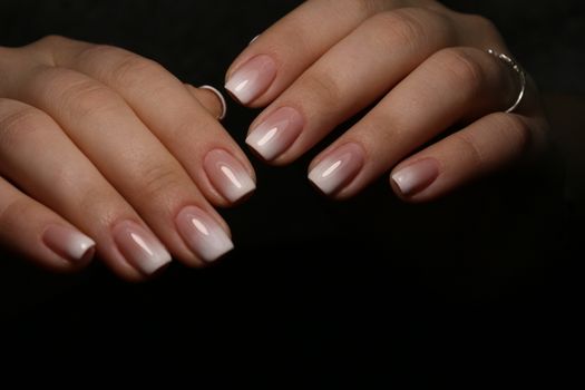 glamorous beautiful manicure on a trendy texture