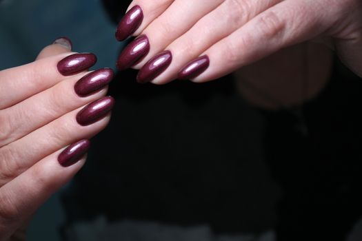 glamorous beautiful manicure on a trendy texture