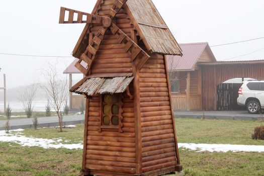 Beautiful wooden mill on a farm. Ukraine