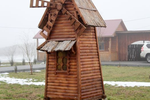 Beautiful wooden mill on a farm. Ukraine