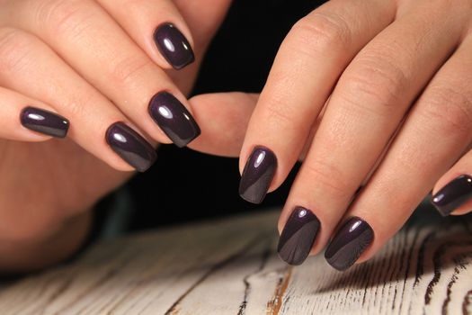 Women's hands with a stylish manicure.